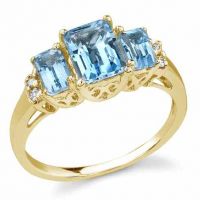 Emerald-Shaped Three-Stone Cathedral Blue Topaz Ring 14K Yellow Gold