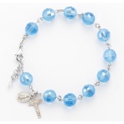 10mm Round Light Sapphire Frosted Rosary Bracelet with a Sterling Silver Crucifx, Miraculous Medal with Rhodium Plated Brass Findings - Boxed 10mm Round Light Sapphire Frosted Rosary Bracelet with a Sterling Silver Crucifx, Miraculous Medal with Rhodium Plated Brass Findings - Boxed